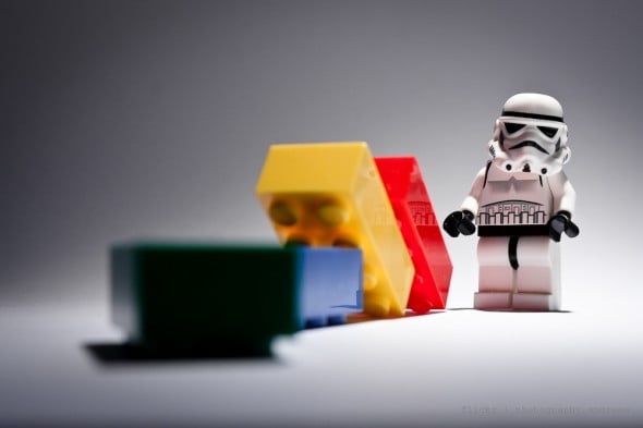 Storm Trooper knocks over dominoes to build momentum