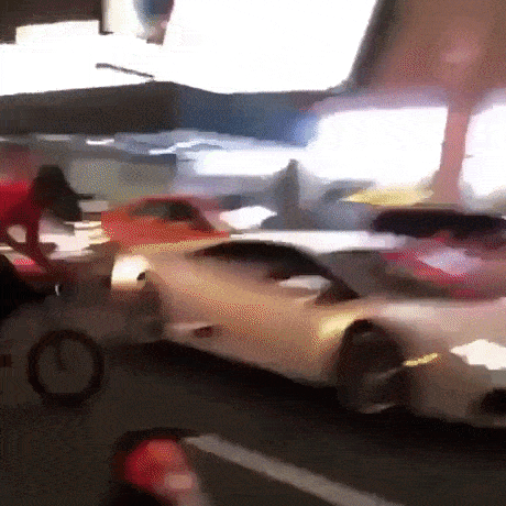 A gif of a biker jumping a car, which you 100% should not do.