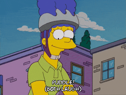 This gif shows Marge and Bart biking and splashing in puddles.