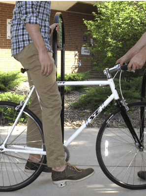 A photo of someone adjusting their bike seat