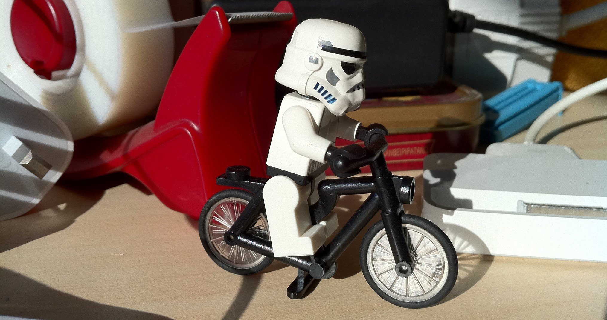 A LEGO Stormtrooper on a bike