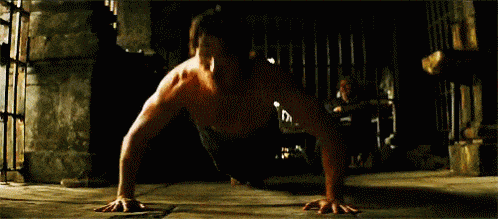 Bruce Wayne doing push-ups