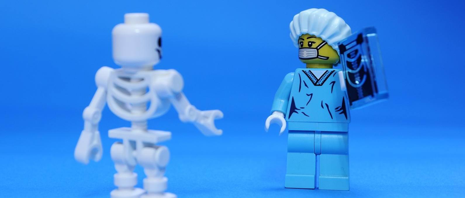 A picture of a doctor and a skeleton, who I don't think can actually get DOMS.