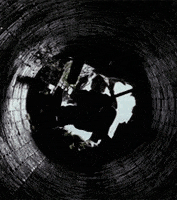 A gif of Bruce falling into a cave