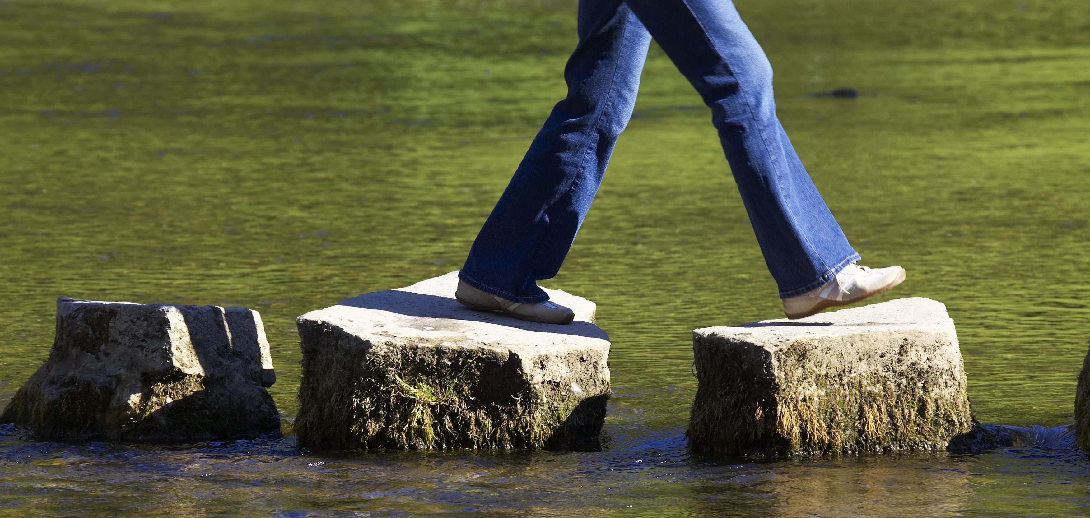 crossing three stepping stones in a river