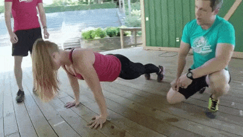 This gif shows Staci doing a push-up in perfect form.