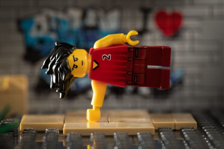 This LEGO man warms up so he doesn't get injured during exercise