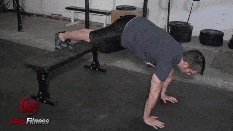 Decline push-ups like this are a unconfined way to progress your bodyweight exercises.