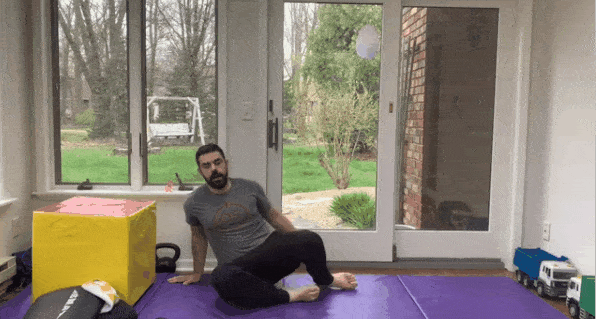 In this flexibility stretch, shown by Coach Matt, you sit down with your feet facing you in front. Try to keep your knees down.