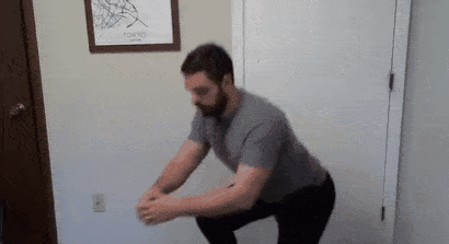 Here, Coach Matt pauses at the bottom of his squat, which will help improve flexibility.