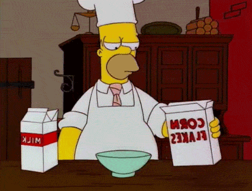 A gif of Homer somehow setting cereal on fire.