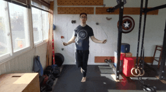 A gif of Coach Matt hopping on one foot while jump roping.