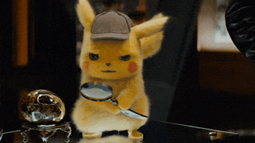 Detective Pikachu is holding up a magnifying glass in this gif.