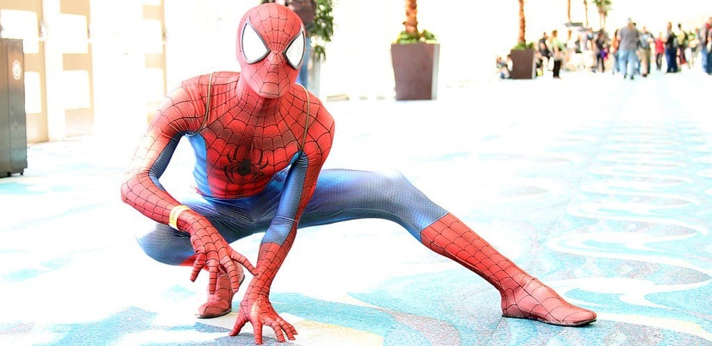 This picture shows a cosplayer as Spider-man, in a flexible pose.