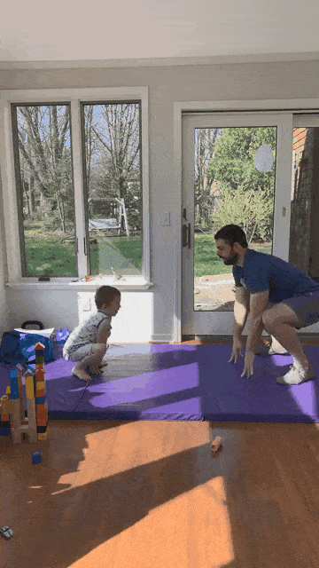 This gif shows both Matt and his kid going from a squat to standing tall, stovepipe up.