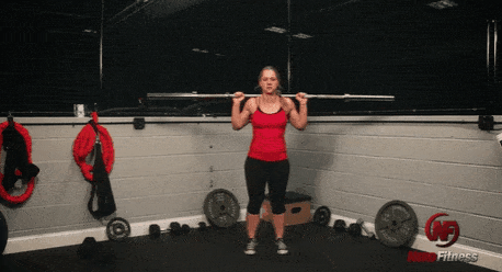  A gif of Coach Staci performing a lunge with a barbell.