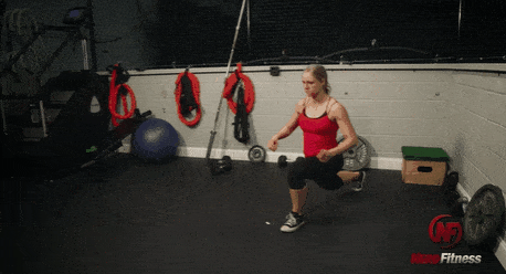 This gif shows Coach Staci performing a pendulum lunge, which is both a forward and reverse lunge.