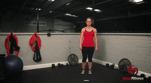 This gif shows Coach Staci doing a bodyweight lunge, a staple bodyweight exercise.