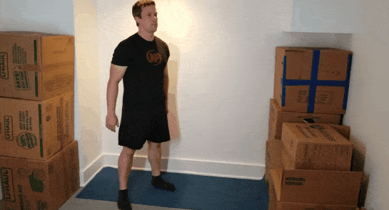 A gif of Coach Jim doing squats in a small space.