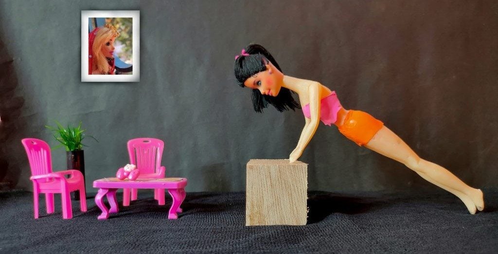 a doll doing a push-up