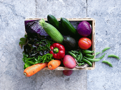 Vegetables sliding out of a basket