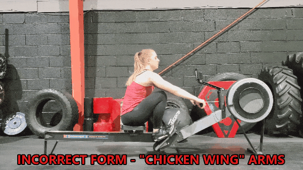 Coach Staci demonstrates incorrect form with "chicken wings"
