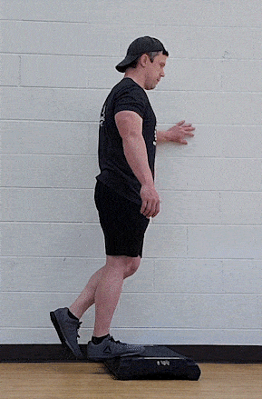 Coach Jim doing a stand one-legged calf raise