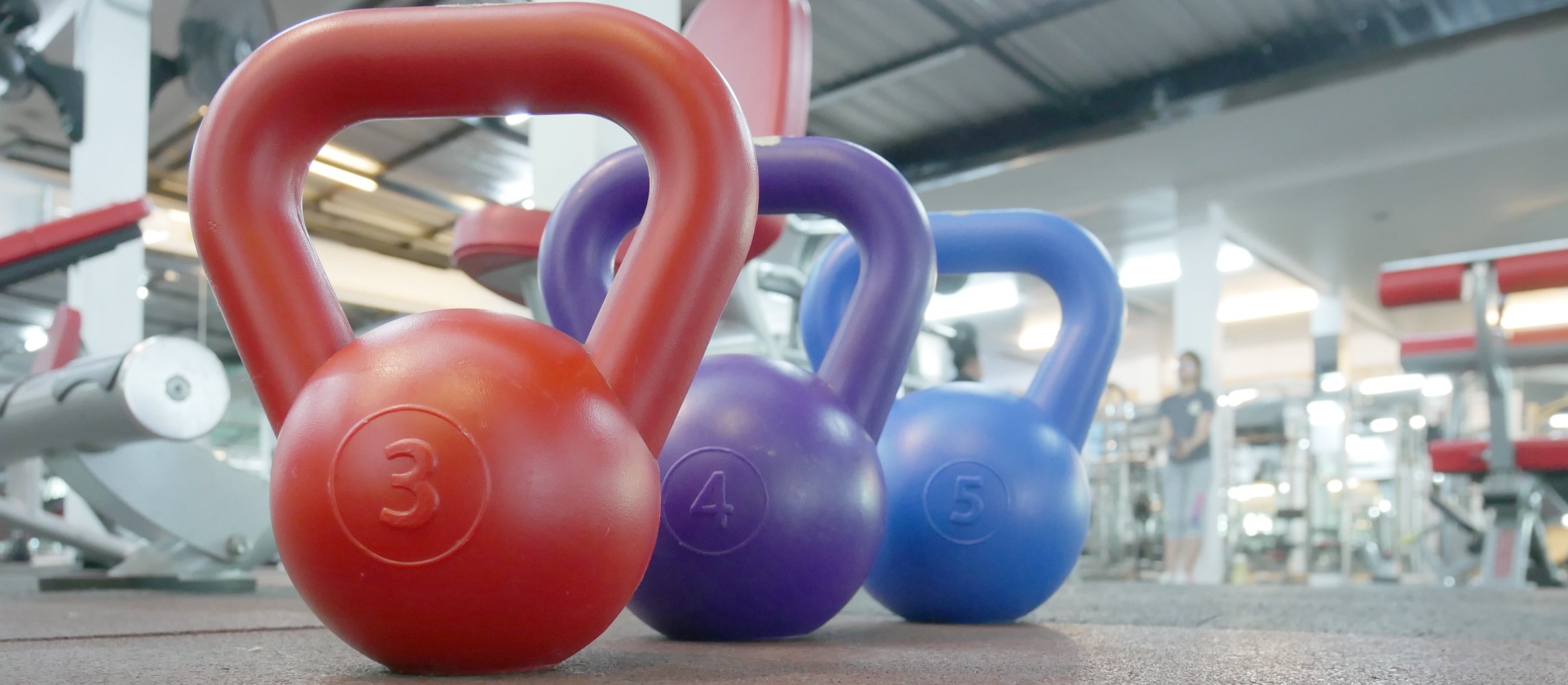 A picture of a row of kettlebells