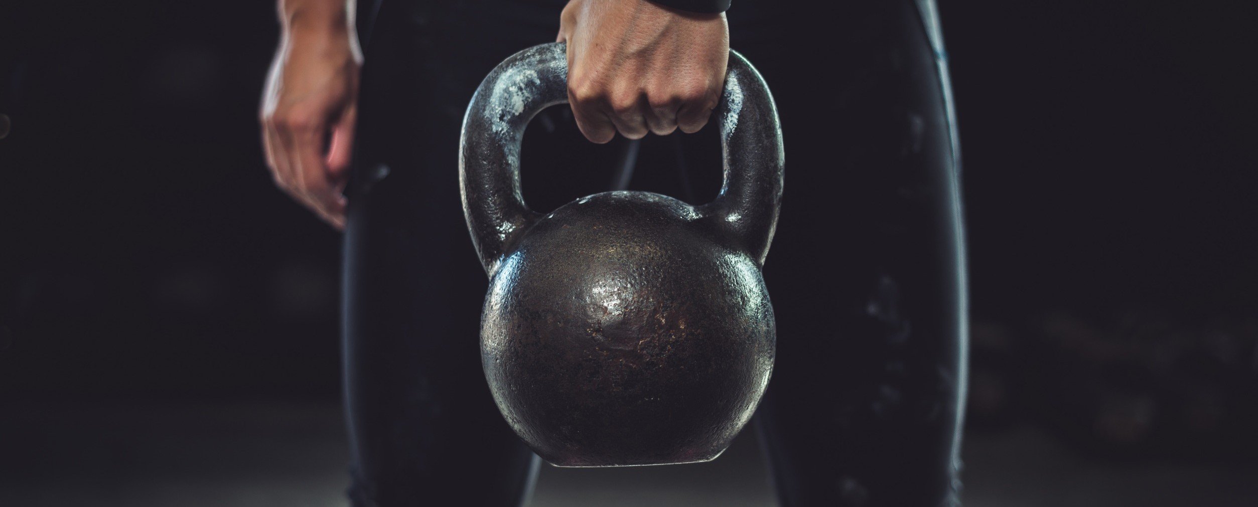 Picture of a woman holding a kettlebell